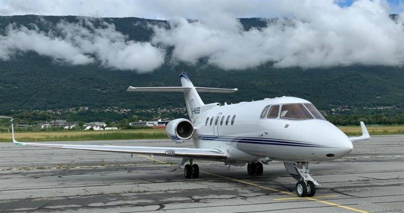 A hawker 900xp sitting on the apron at the airport